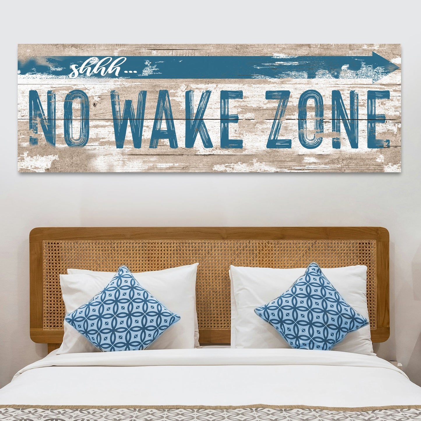 Canvas No Wake Zone XIV by Tailored Canvases with rustic wood backdrop and blue text above bed on Tampa Home & Garden Store