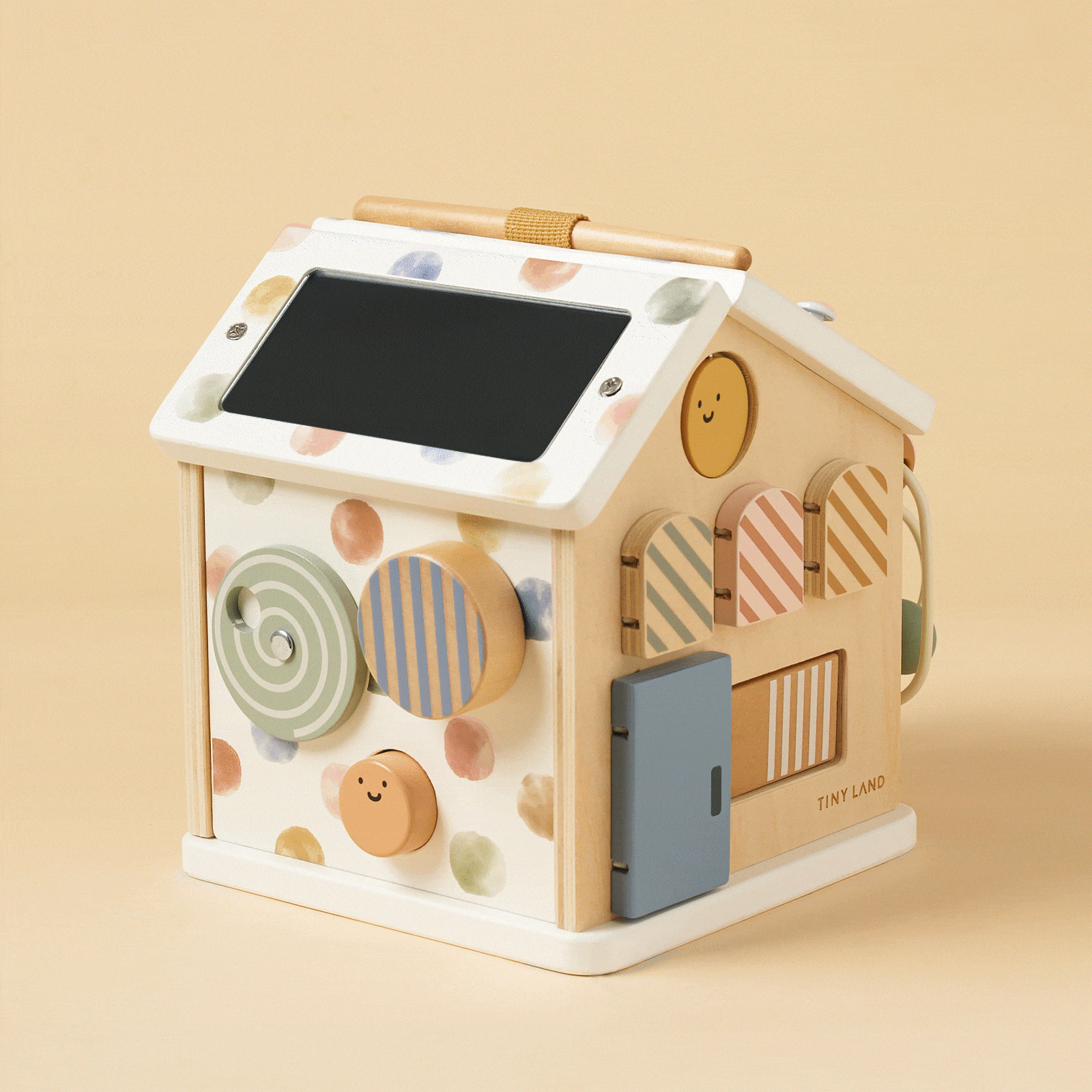 Tiny Land Cottage Activity Cube Morandi wooden toy with pastel shapes and a smiley face on Tampa Home & Garden Store