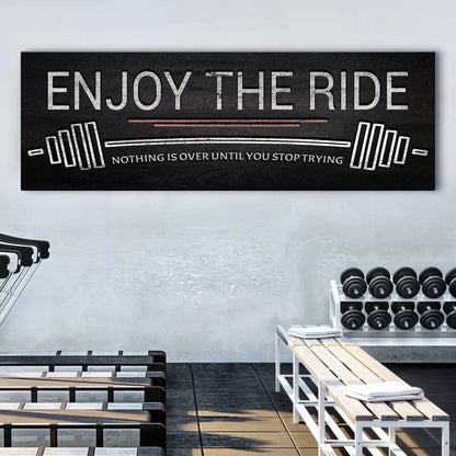 Canvas sign Enjoy The Ride gym motif with white text and weight plate graphics on black backdrop on Tampa Home & Garden Store
