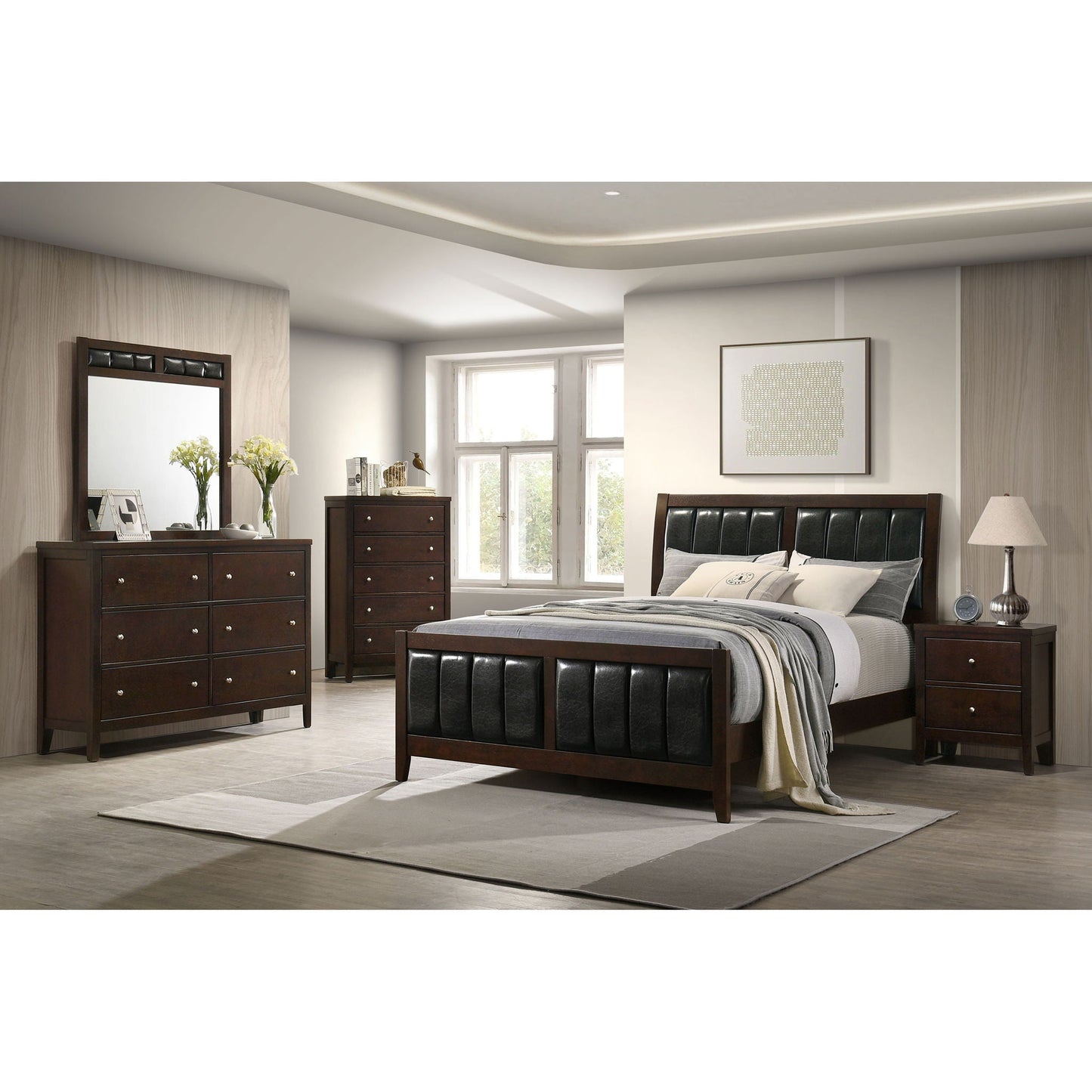 Queen panel bed with brown wood frame and black upholstered headboard and footboard plus dressers on Tampa Home & Garden Store