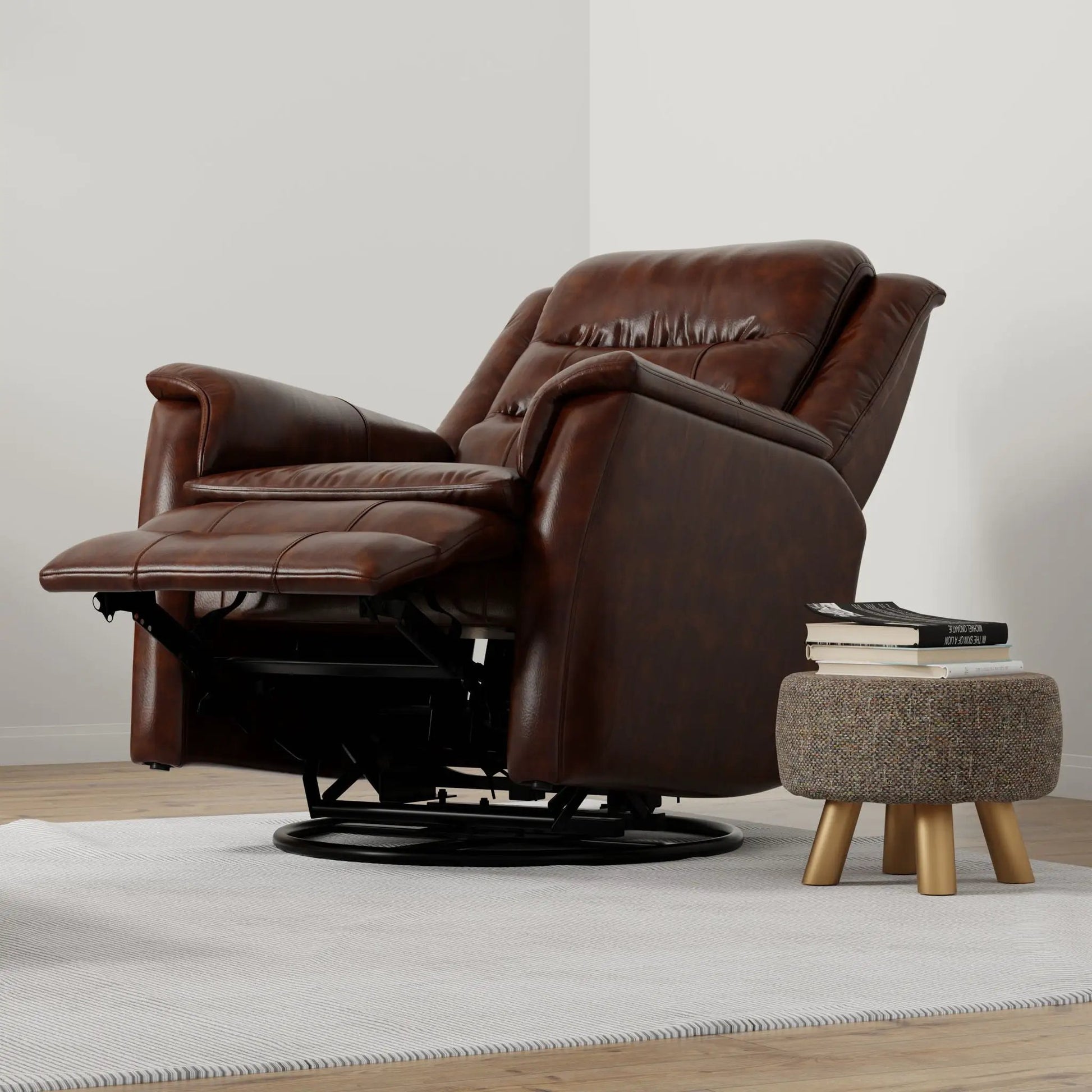 Brown leather swivel recliner with manual footrest on base beside a stool with books on Tampa Home & Garden Store