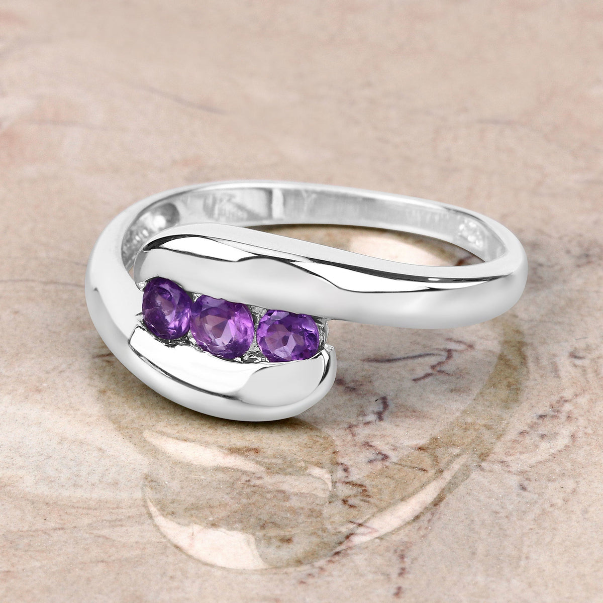 Genuine amethyst ring in .925 sterling silver with 0.54ct total purple stones along the band on Tampa Home & Garden Store