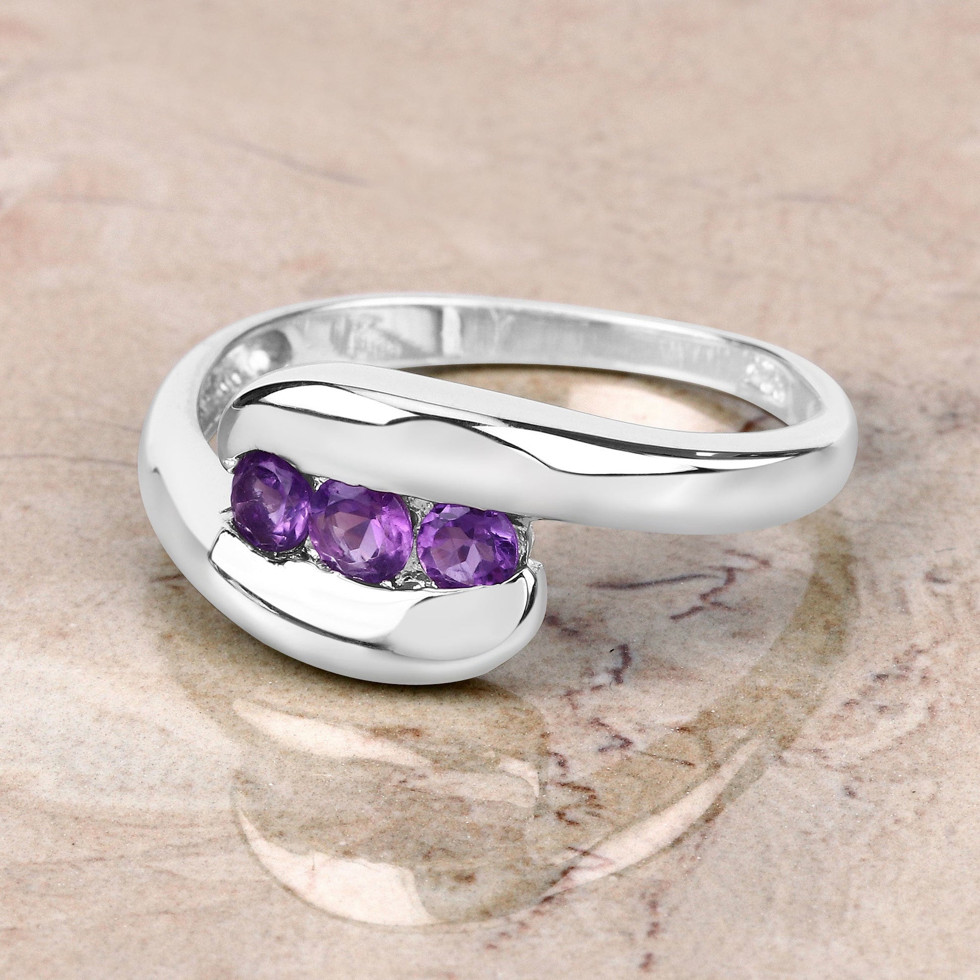 Genuine amethyst ring in .925 sterling silver with 0.54ct total purple stones along the band on Tampa Home & Garden Store
