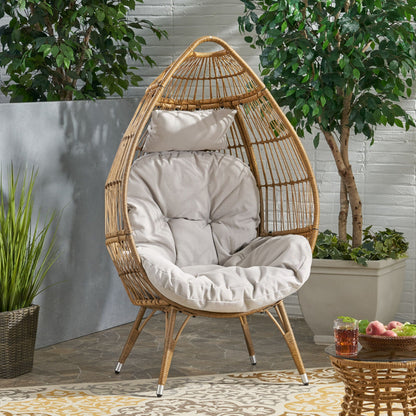 Basket teardrop wicker chair with natural finish and water-resistant cushion on Tampa Home & Garden Store