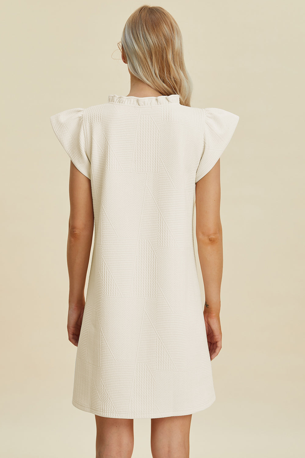 Stevvex ivory textured dress with ruffled cap sleeves, back view, full-size on Tampa Home & Garden Store