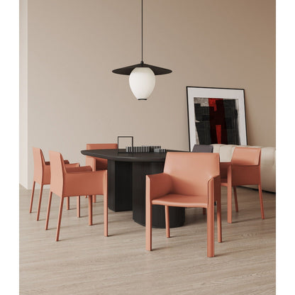 Vogue dining chairs with metal frames in coral-pink around round black table on Tampa Home & Garden Store