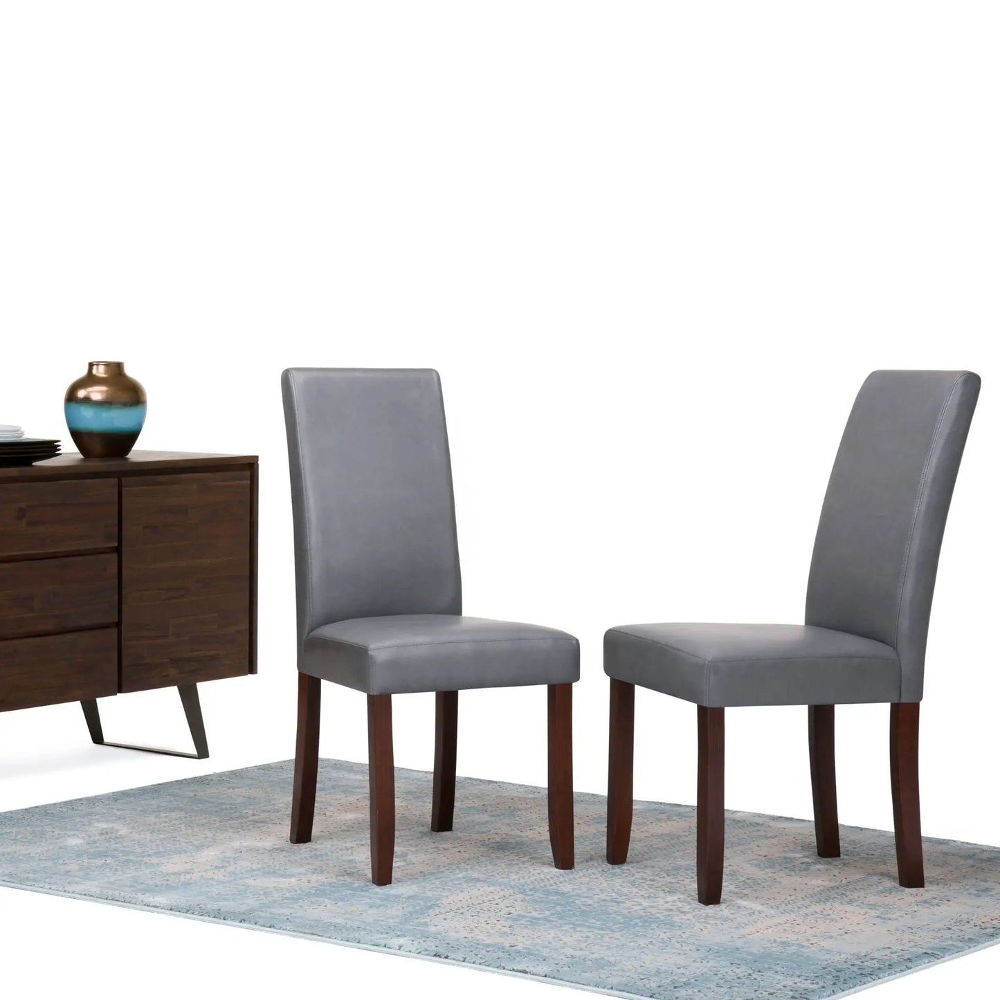 Acadian upholstered Parson chairs set of 2 in gray fabric with wood legs beside sideboard on Tampa Home & Garden Store