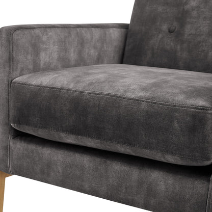 Tufted back accent arm chair in dark gray upholstery, close-up of armrest and tufted back on Tampa Home & Garden Store