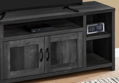 TV stand console in dark wood finish with open shelf and two cabinet doors; left-side DVD player on Tampa Home & Garden Store
