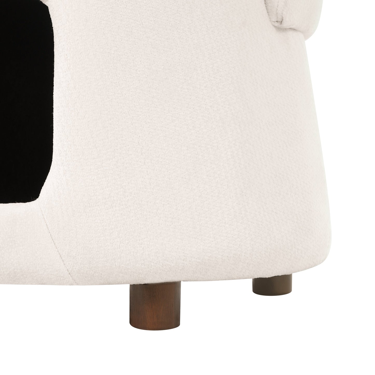 Beige upholstered chair with dark wooden legs, close-up view on Tampa Home & Garden Store