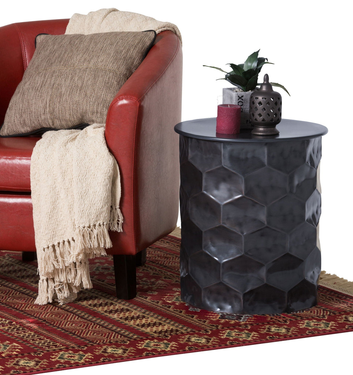 Handcrafted metal storage table with removable top in dark hammered finish beside leather chair on Tampa Home & Garden Store