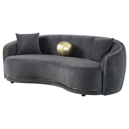 Luxe curved gray sofa by HouseOfZazla with diamond quilted cushions and gold trim on Tampa Home & Garden Store