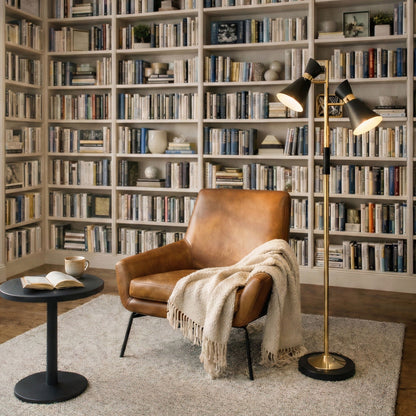 Axis floor lamp with four-way switch, double black shades on a gold base in a living room on Tampa Home & Garden Store