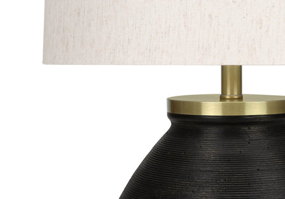 Table lamp Unique Piece Furniture with black ribbed base, brass collar, cream linen shade on Tampa Home & Garden Store