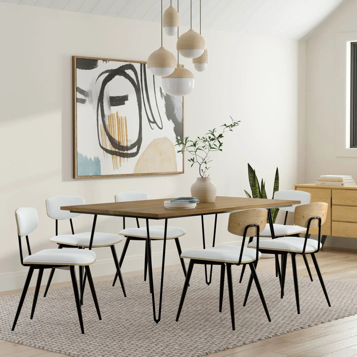 Hunter - Handcrafted Dining Table with wooden top and black metal legs in a modern dining room on Tampa Home & Garden Store