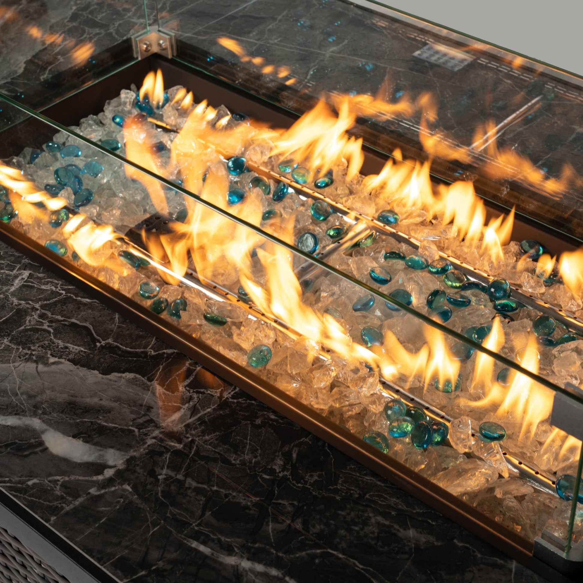 44' Propane Fire Pit Table by HouseOfZazla with tile top and wicker base, glass accents on Tampa Home & Garden Store