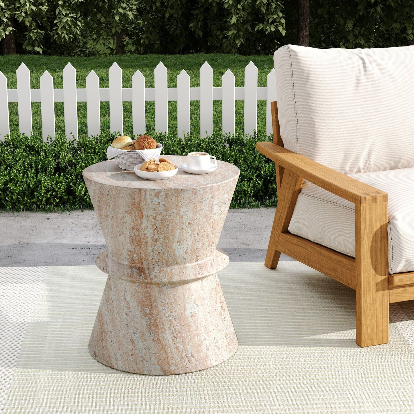 Outdoor concrete side table with beige travertine finish beside a cushioned wooden chair on Tampa Home & Garden Store