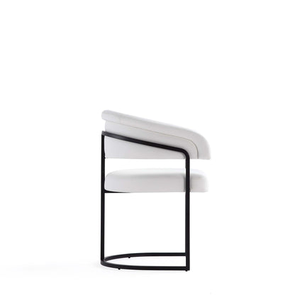 Geometric base dining chair with white vegan upholstery and black cantilever frame on Tampa Home & Garden Store