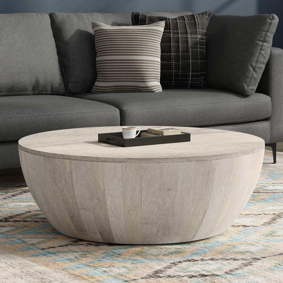 Elmbrook Drum Coffee Table in light wood with a rounded drum base and marble-like top on Tampa Home & Garden Store