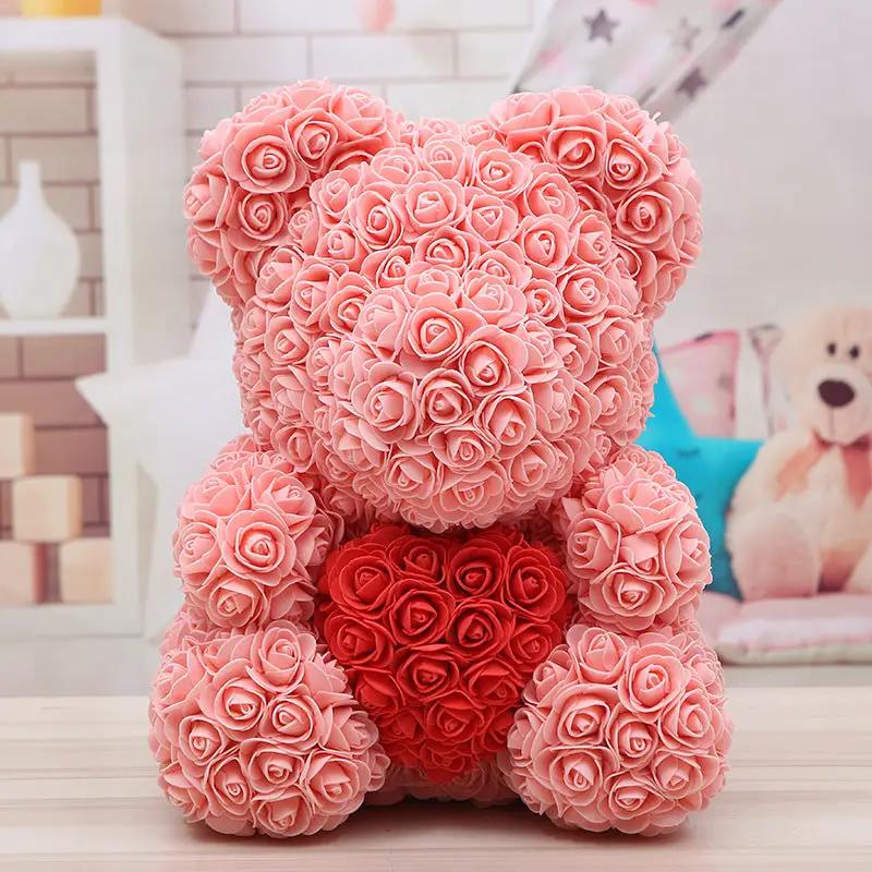 Pink rose teddy bear covered in rose blossoms with a red heart centerpiece on Tampa Home & Garden Store