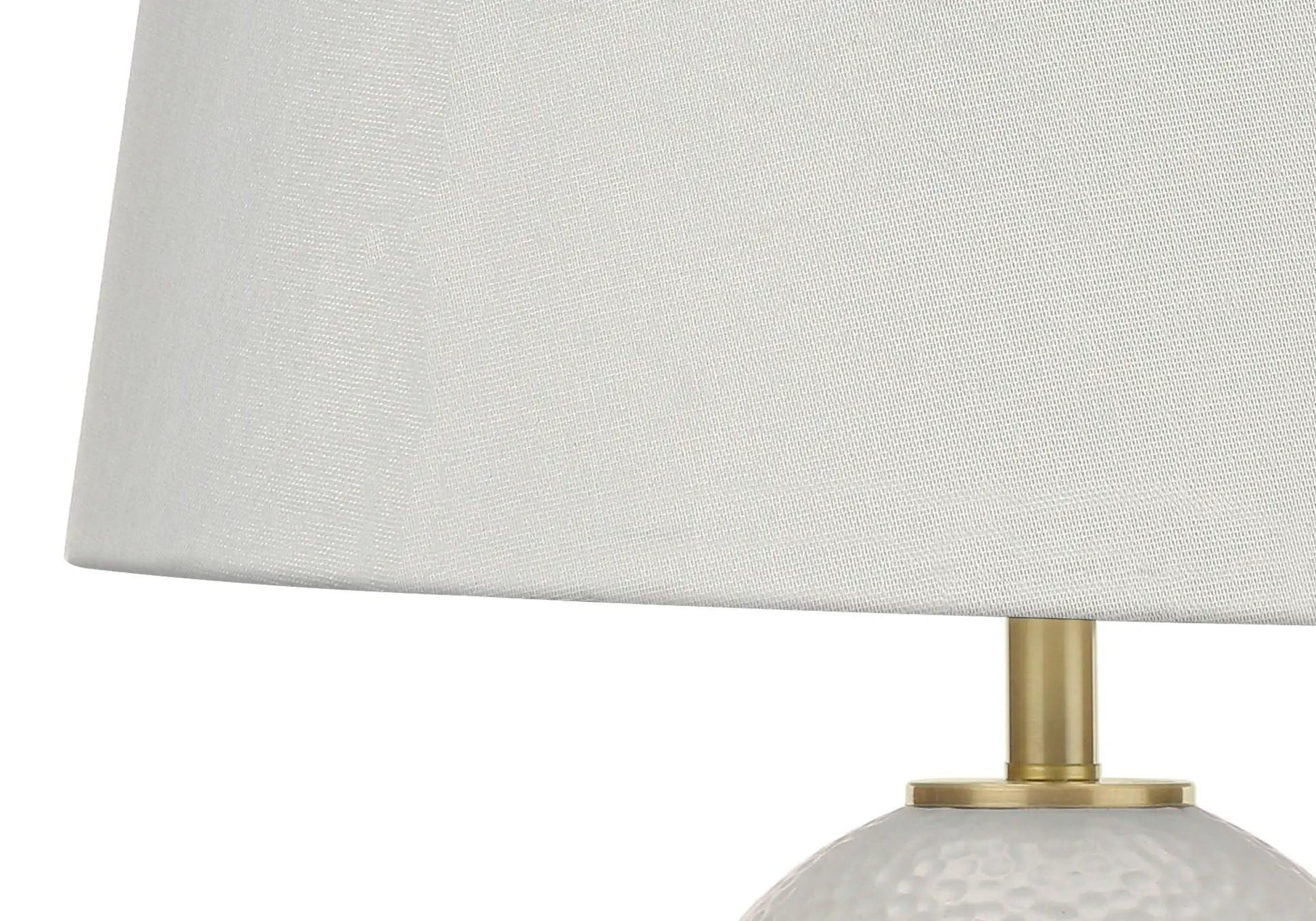 Table lamp white ceramic base with hammered texture and brass stem, white fabric shade on Tampa Home & Garden Store