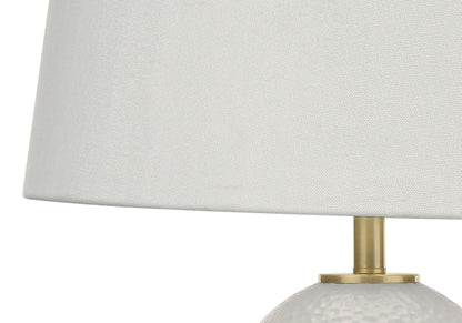Table lamp white ceramic base with hammered texture and brass stem, white fabric shade on Tampa Home & Garden Store