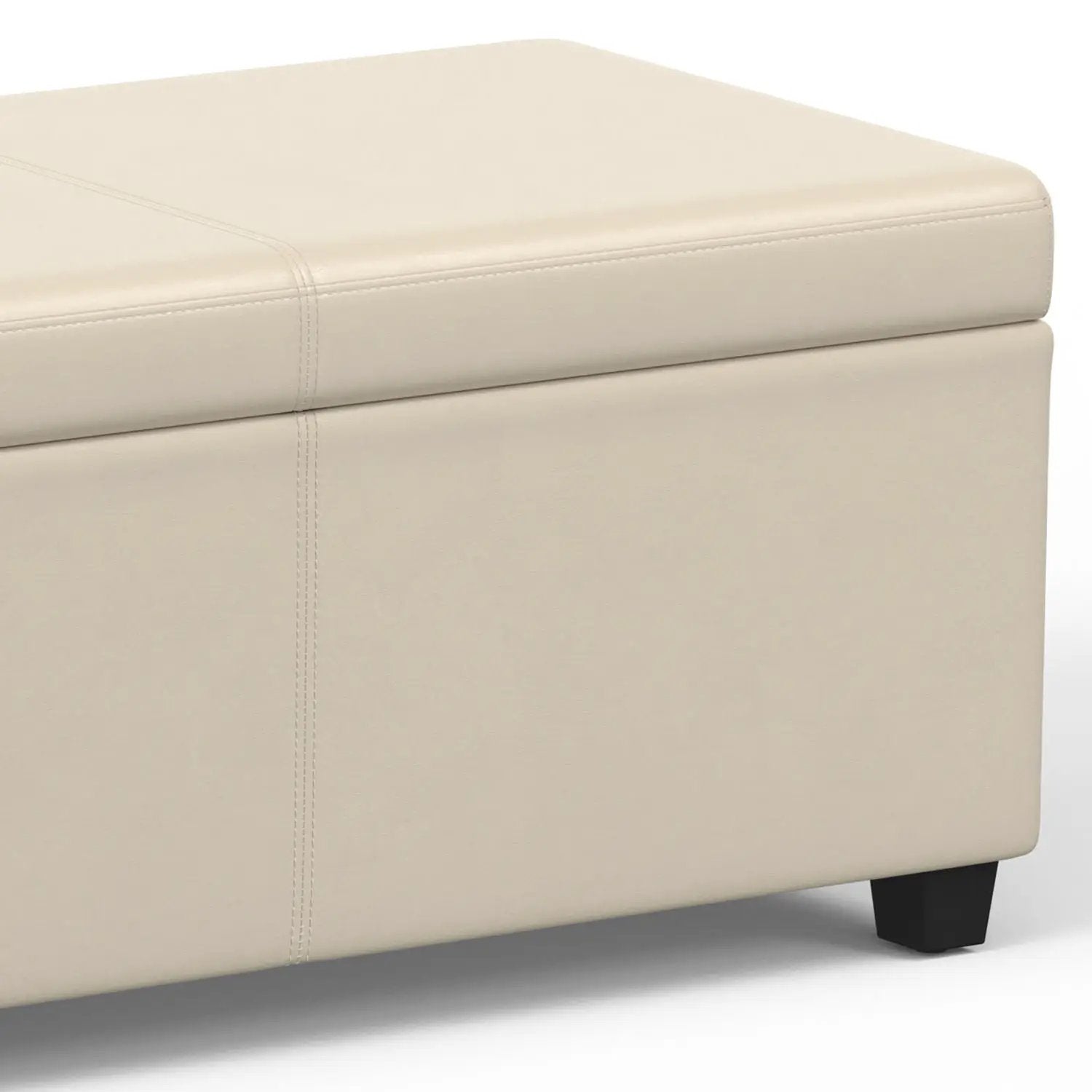 Avalon storage ottoman bench in beige faux leather with clean stitched seams and chunky legs on Tampa Home & Garden Store