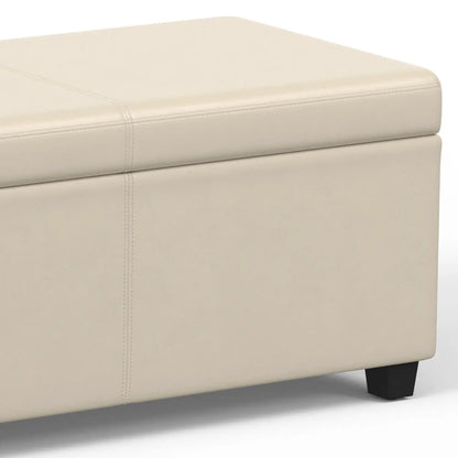 Avalon storage ottoman bench in beige faux leather with clean stitched seams and chunky legs on Tampa Home & Garden Store