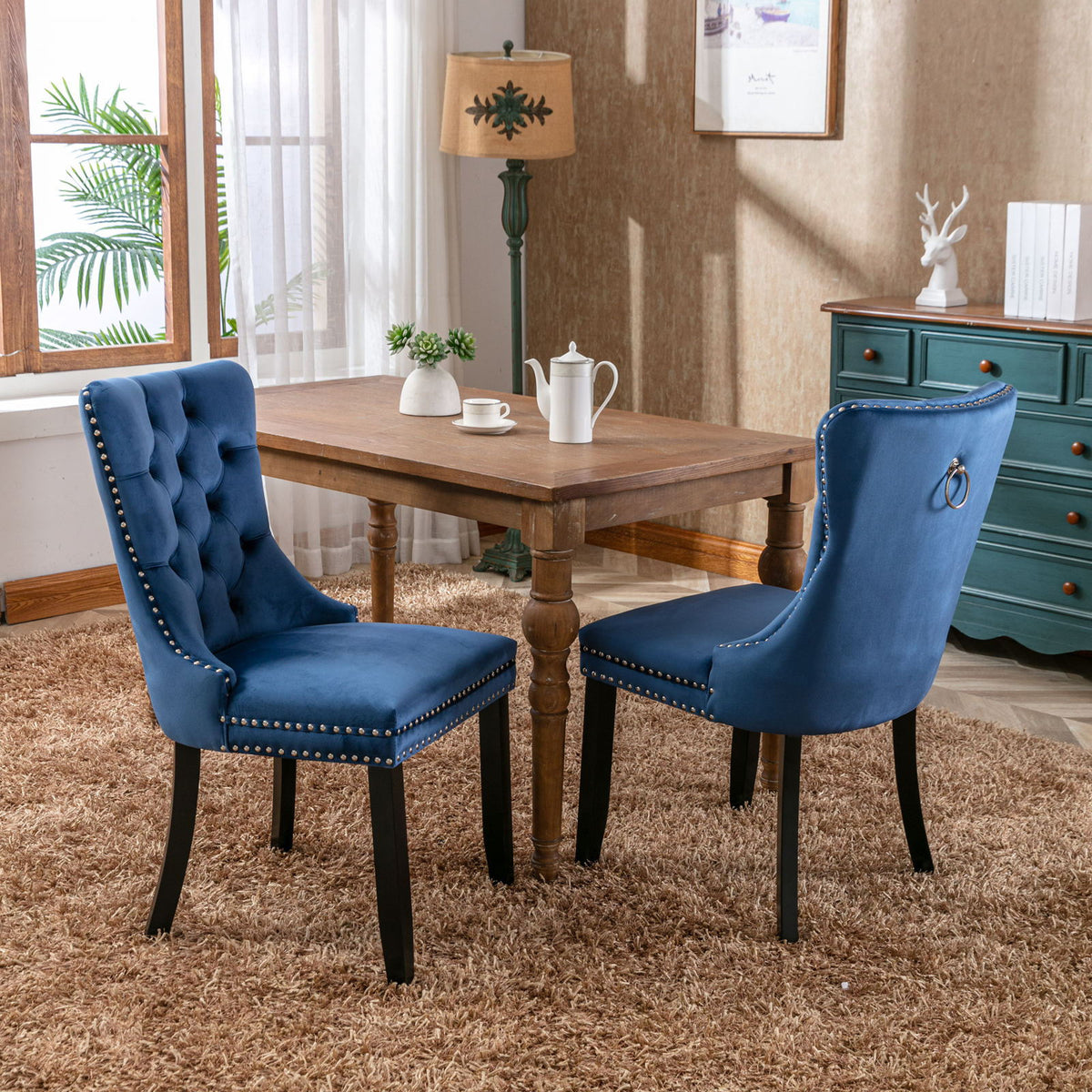 Tufted dining chair set of two in blue velvet with nailhead trim and dark wooden legs on Tampa Home & Garden Store