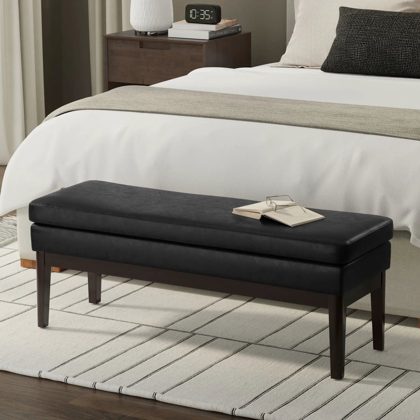 Carlson Ottoman Bench with black leather cushion and dark wood legs, mid-century design on Tampa Home & Garden Store