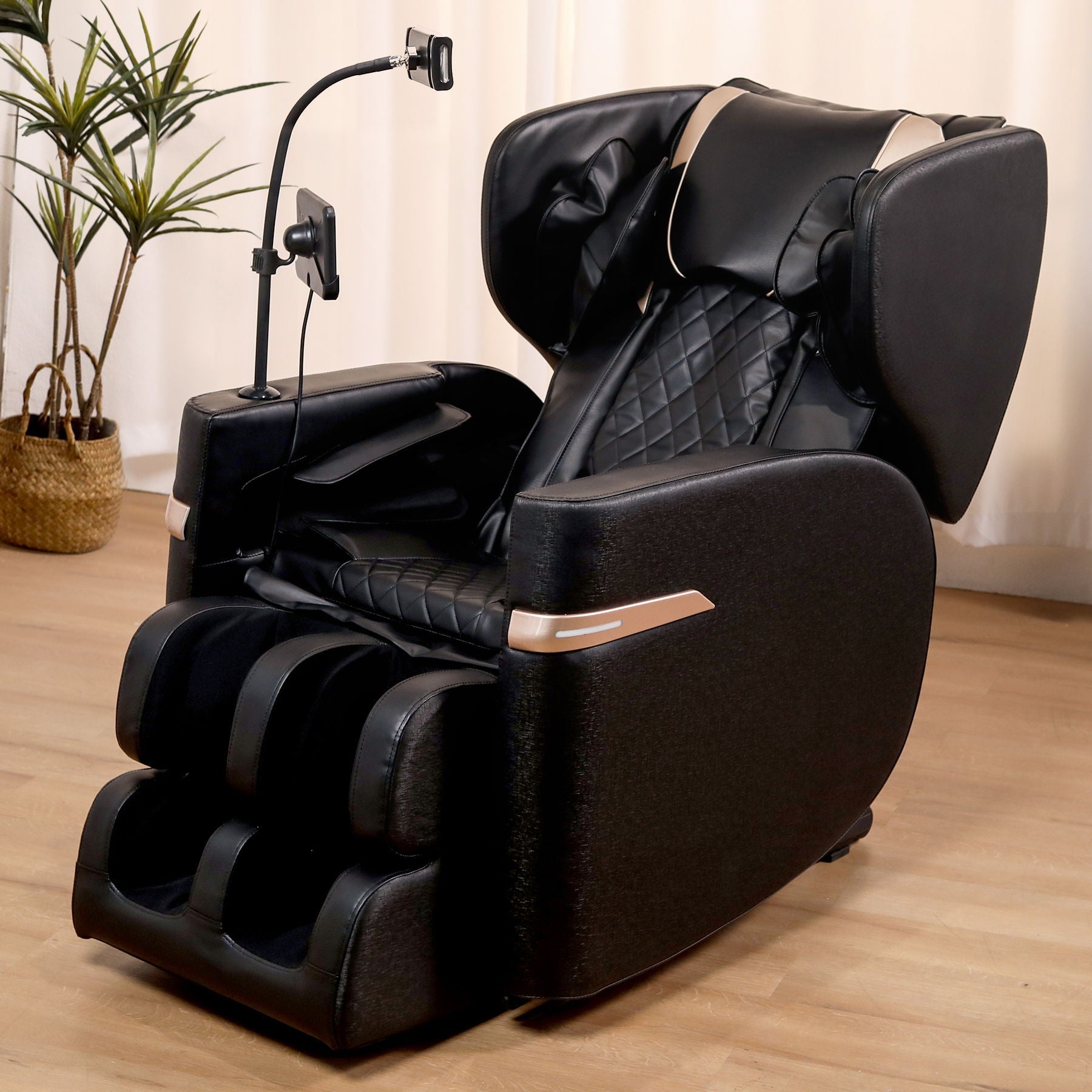 Black massage chair recliner with quilted leather upholstery and built in remote on adjustable stand on Tampa Home & Garden Store