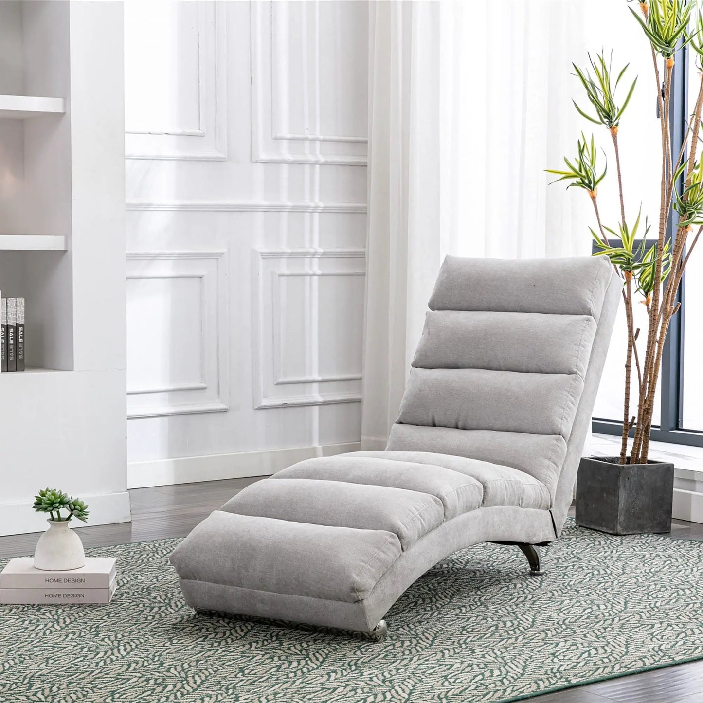 Massage chaise lounge indoor with remote control in light gray upholstery beside a plant on Tampa Home & Garden Store