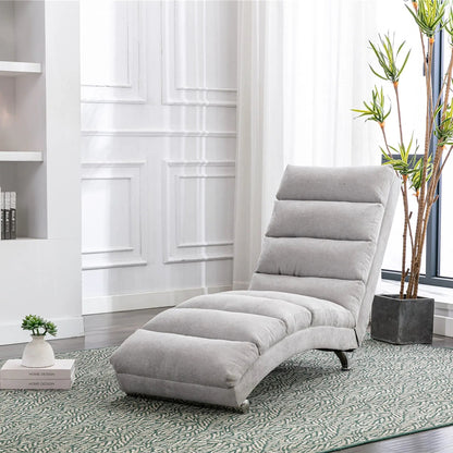Massage chaise lounge indoor with remote control in light gray upholstery beside a plant on Tampa Home & Garden Store