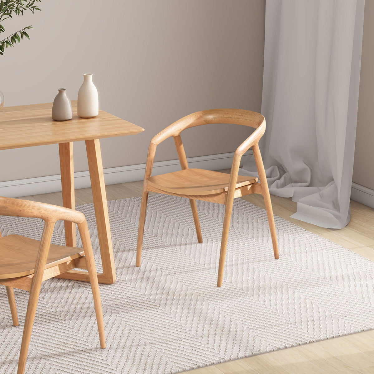 Scandinavian sculpted dining armchairs in warm natural brown wood with comfortable arms on Tampa Home & Garden Store