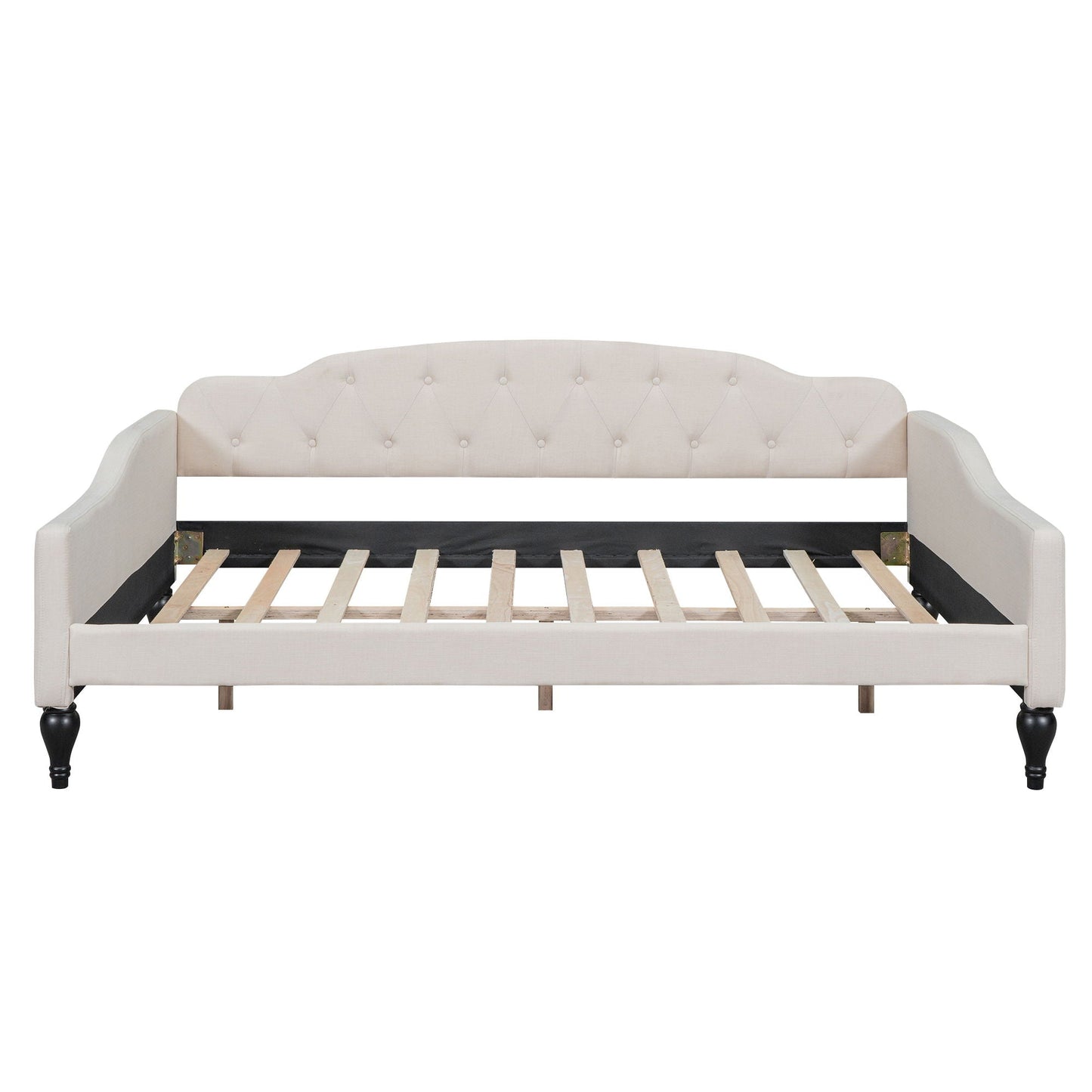 Upholstered tufted daybed in cream fabric with curved arms and button-tufted back, wooden legs on Tampa Home & Garden Store