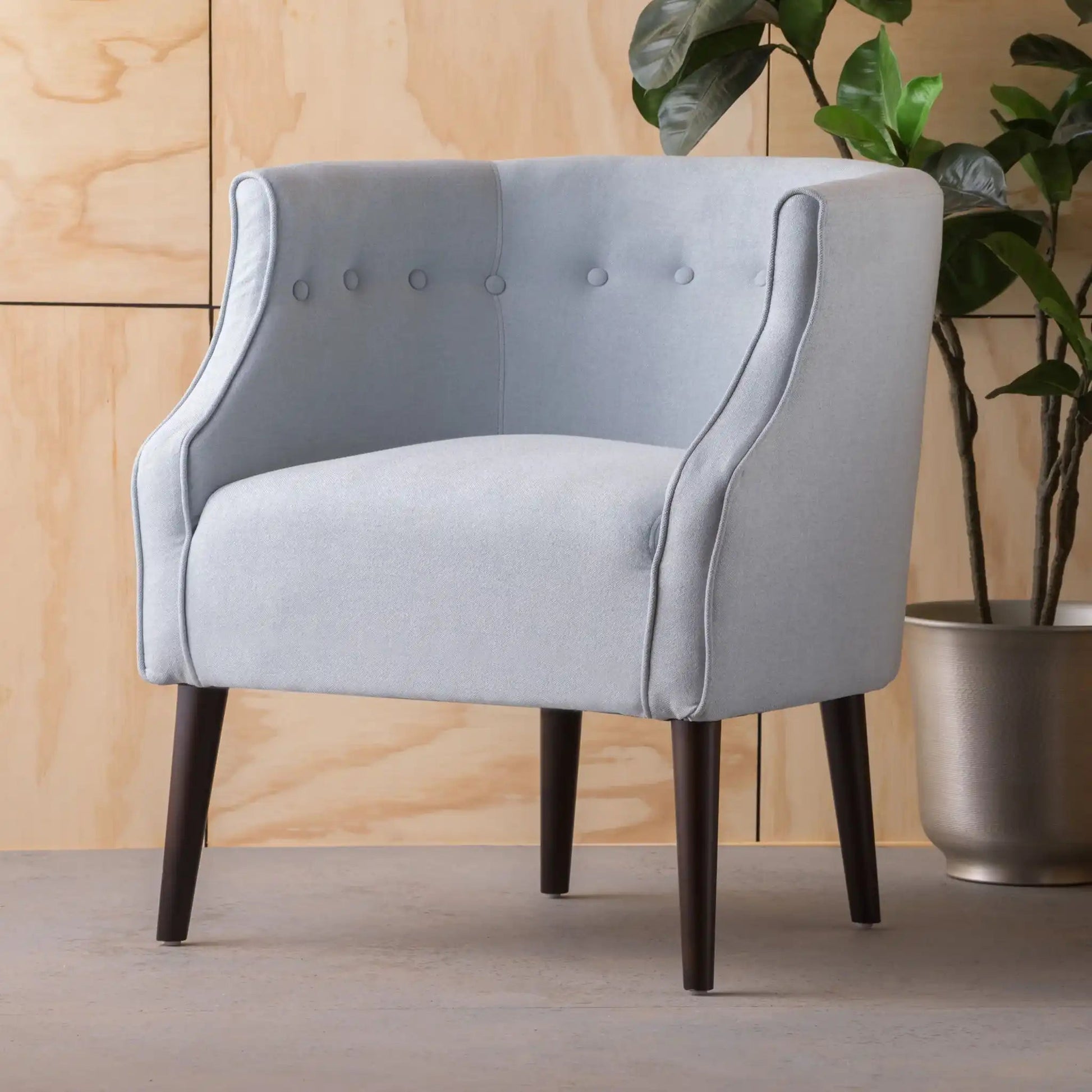 Contemporary club chair with button tufting, light gray fabric, dark wood legs on Tampa Home & Garden Store