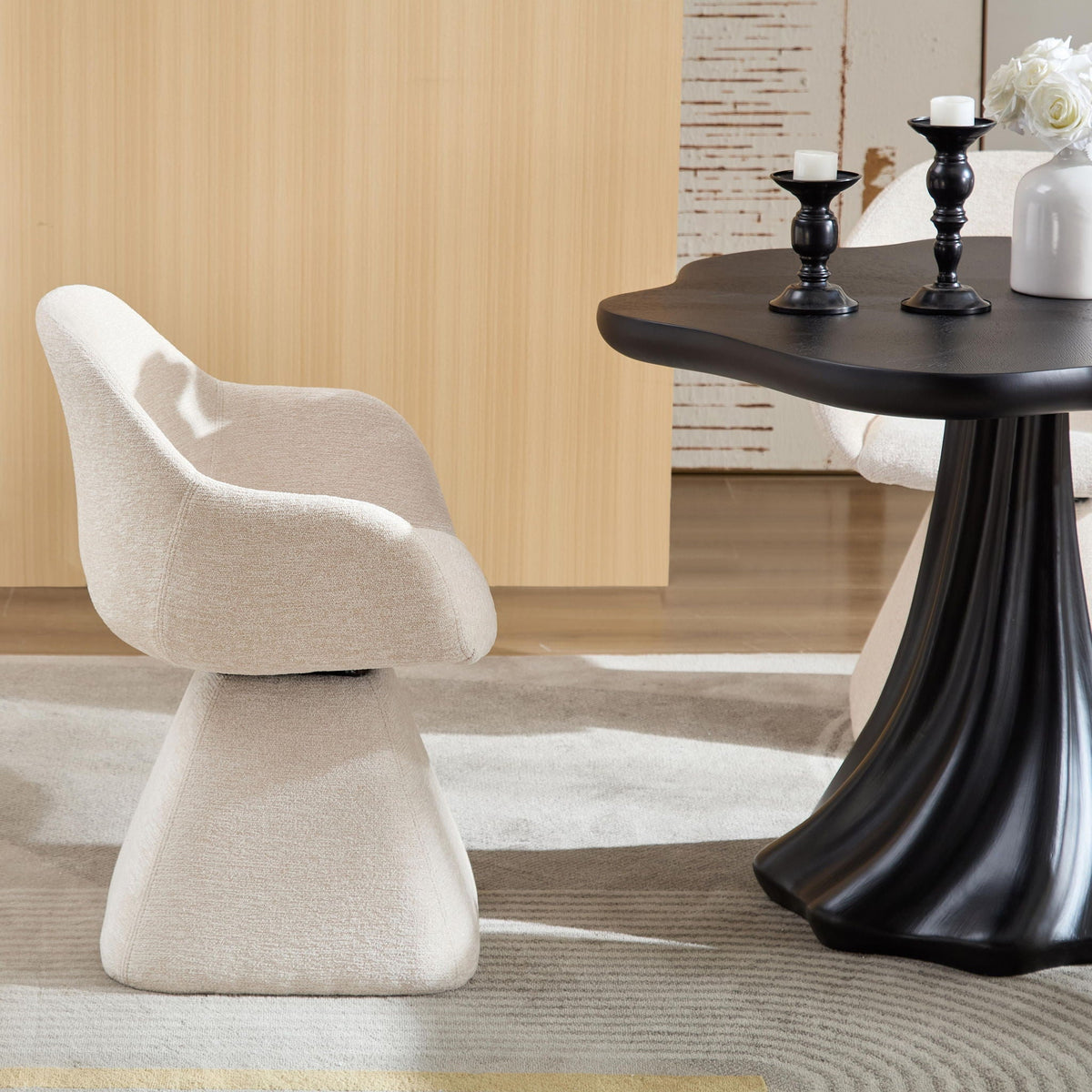 Beige velvet barrel-back swivel accent chair beside a pedestal table with candlesticks on Tampa Home & Garden Store