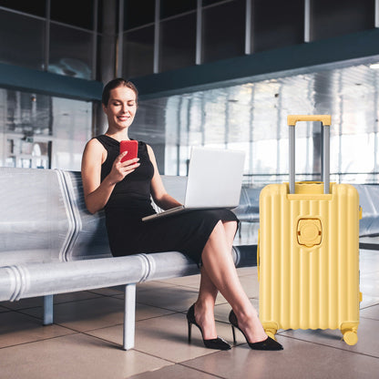 Yellow 3-piece spinner luggage set beside a woman using a red smartphone and laptop on Tampa Home & Garden Store