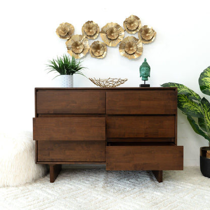 Brown solid wood mid-century dresser with 6 drawers, shown with plants and gold wall art on Tampa Home & Garden Store