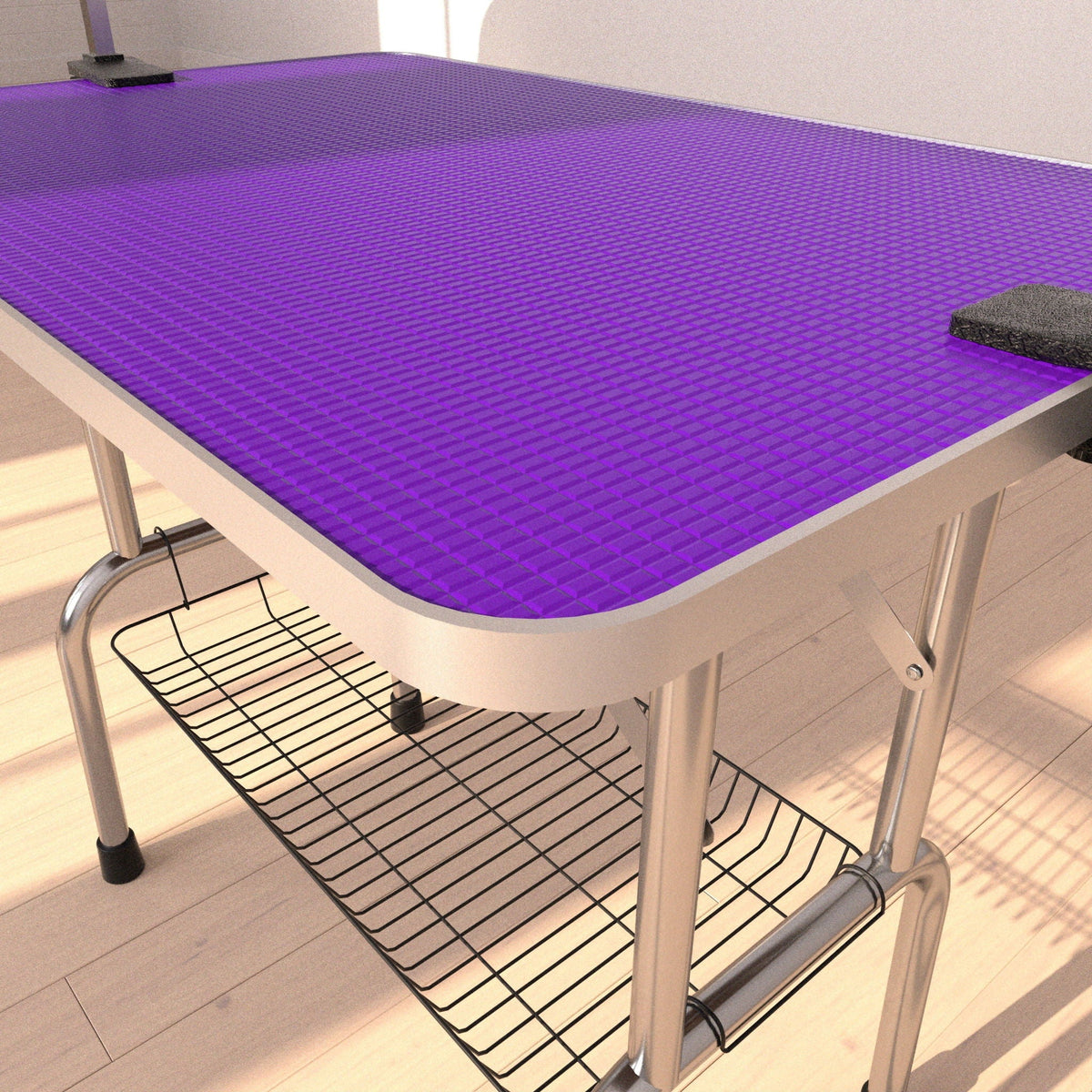 Folding dog grooming table with purple rubber mat and arm clamps on Tampa Home & Garden Store