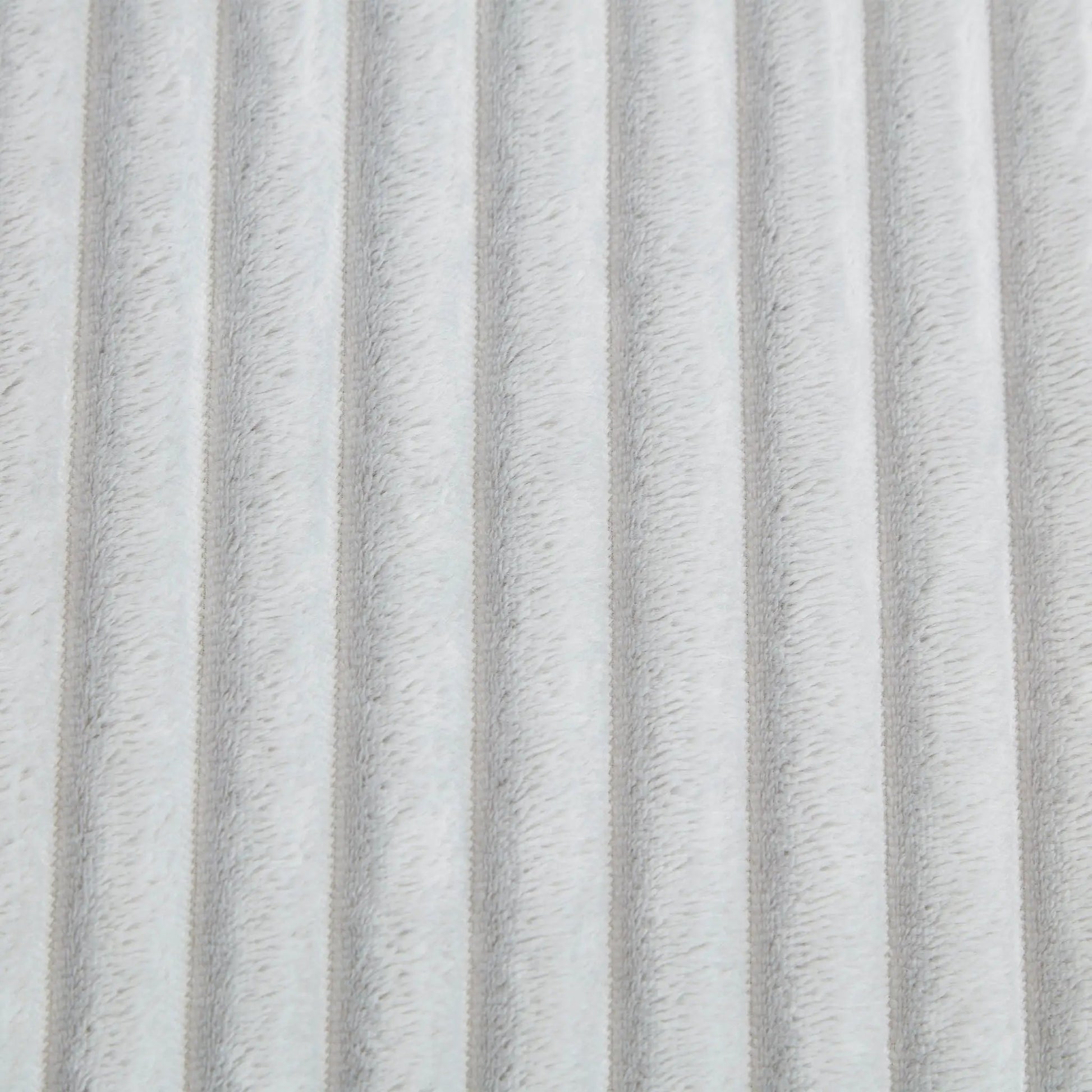 Chaises plush upholstery fabric close-up in light gray, soft fur-like texture on Tampa Home & Garden Store