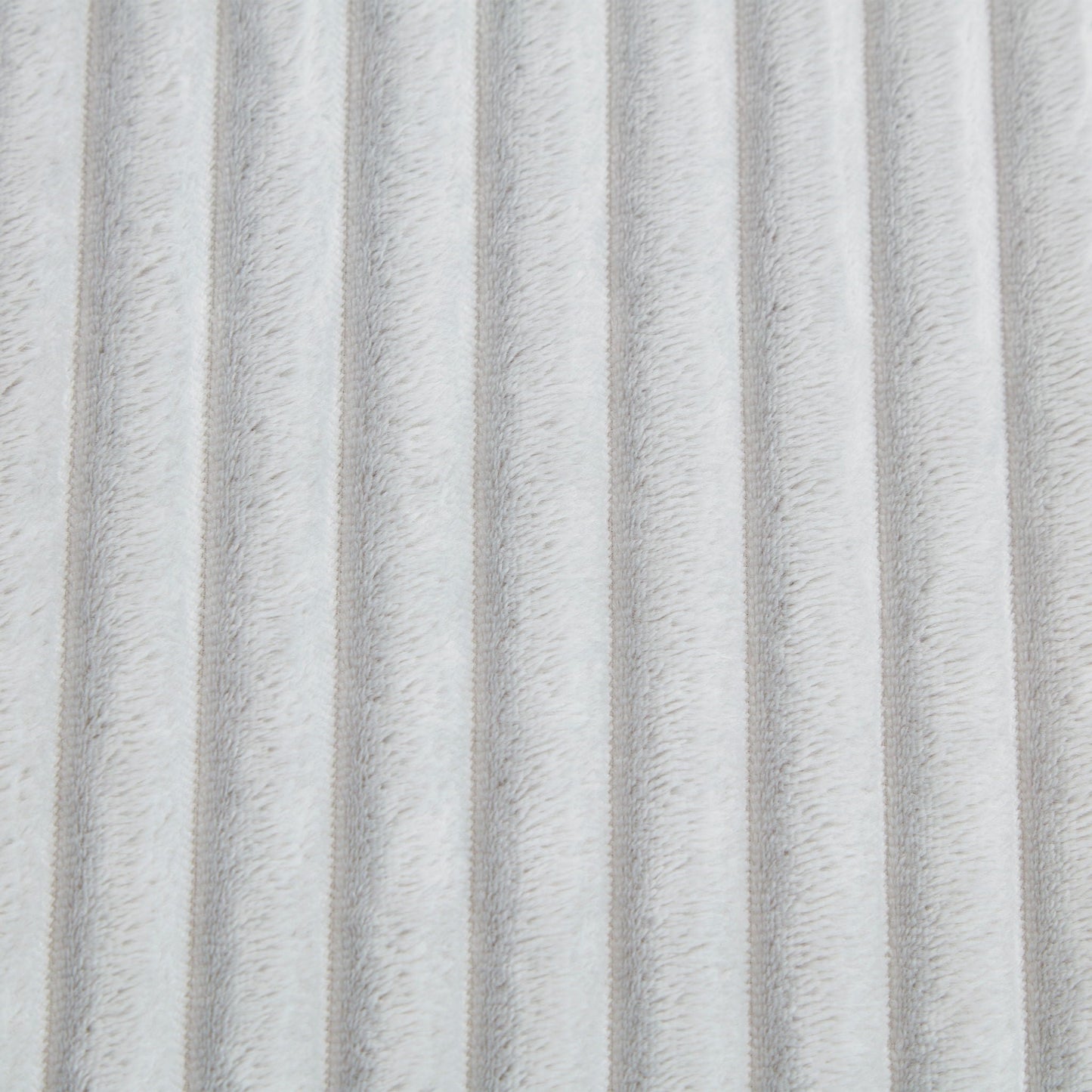 Chaise upholstery close-up in light gray plush fabric with ribbed texture on Tampa Home & Garden Store