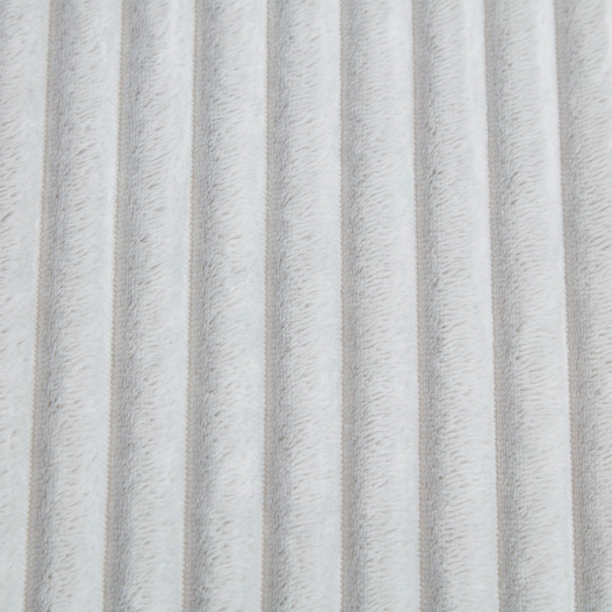 Chaise upholstery close-up in light gray plush fabric with ribbed texture on Tampa Home & Garden Store