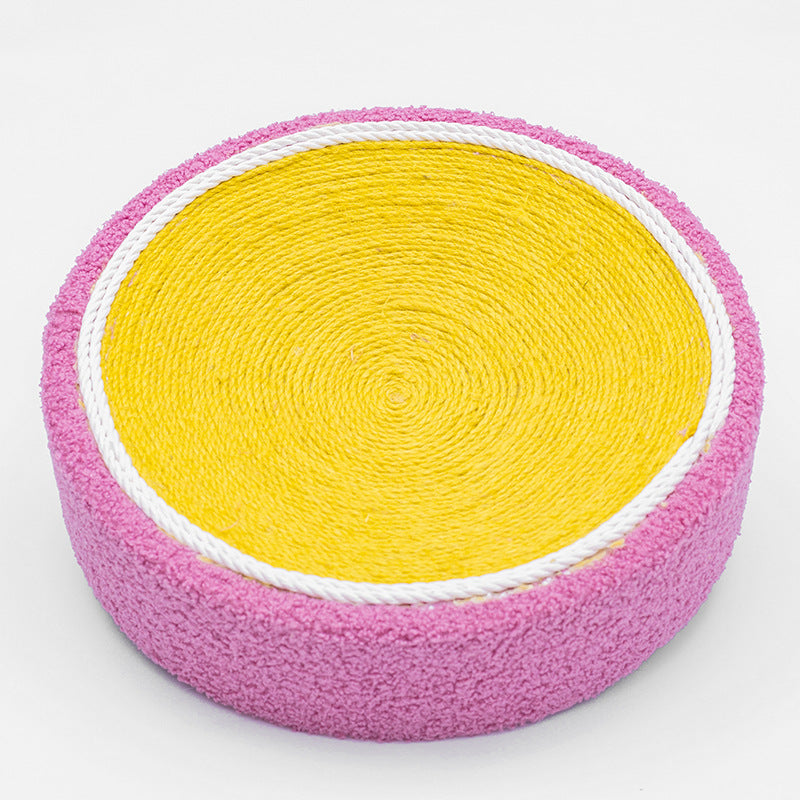 Cat scratch board round toy with yellow corrugated center and pink fuzzy outer edge on Tampa Home & Garden Store
