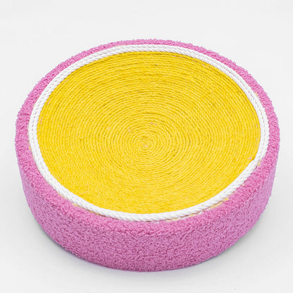 Cat scratch board round toy with yellow corrugated center and pink fuzzy outer edge on Tampa Home & Garden Store