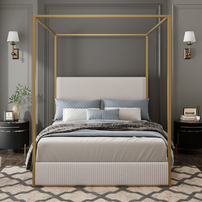 Luxury canopy bed with upholstered headboard, gold metal frame and grey bedding on Tampa Home & Garden Store
