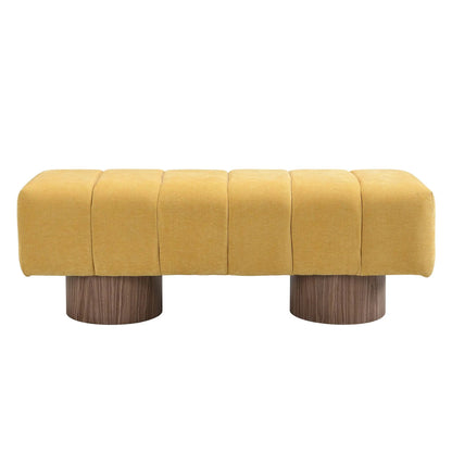 Upholstered yellow fabric dining bench with segmented cushions and wood legs on Tampa Home & Garden Store