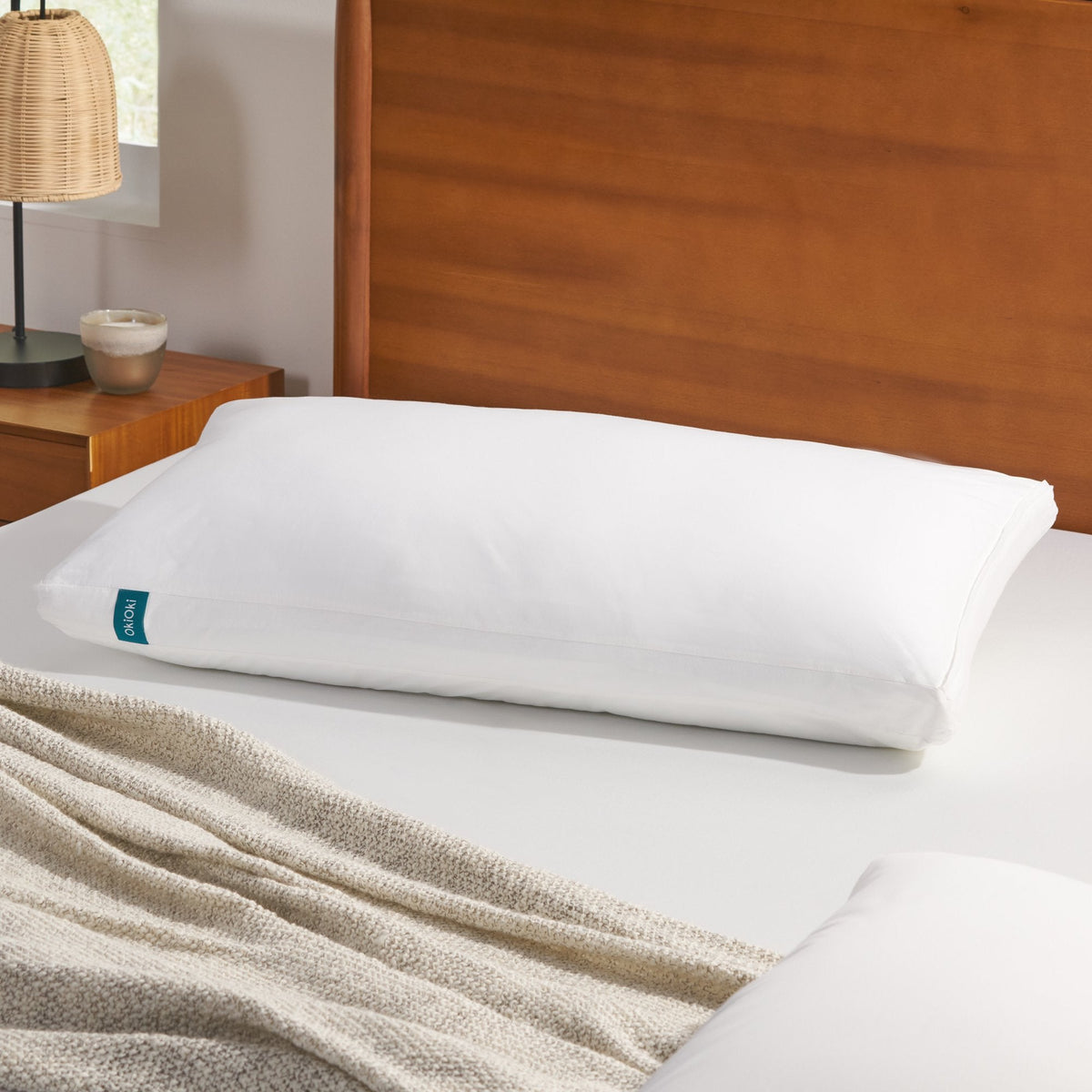 White premium down-alternative pillow with hypoallergenic fill on a neatly made bed on Tampa Home & Garden Store