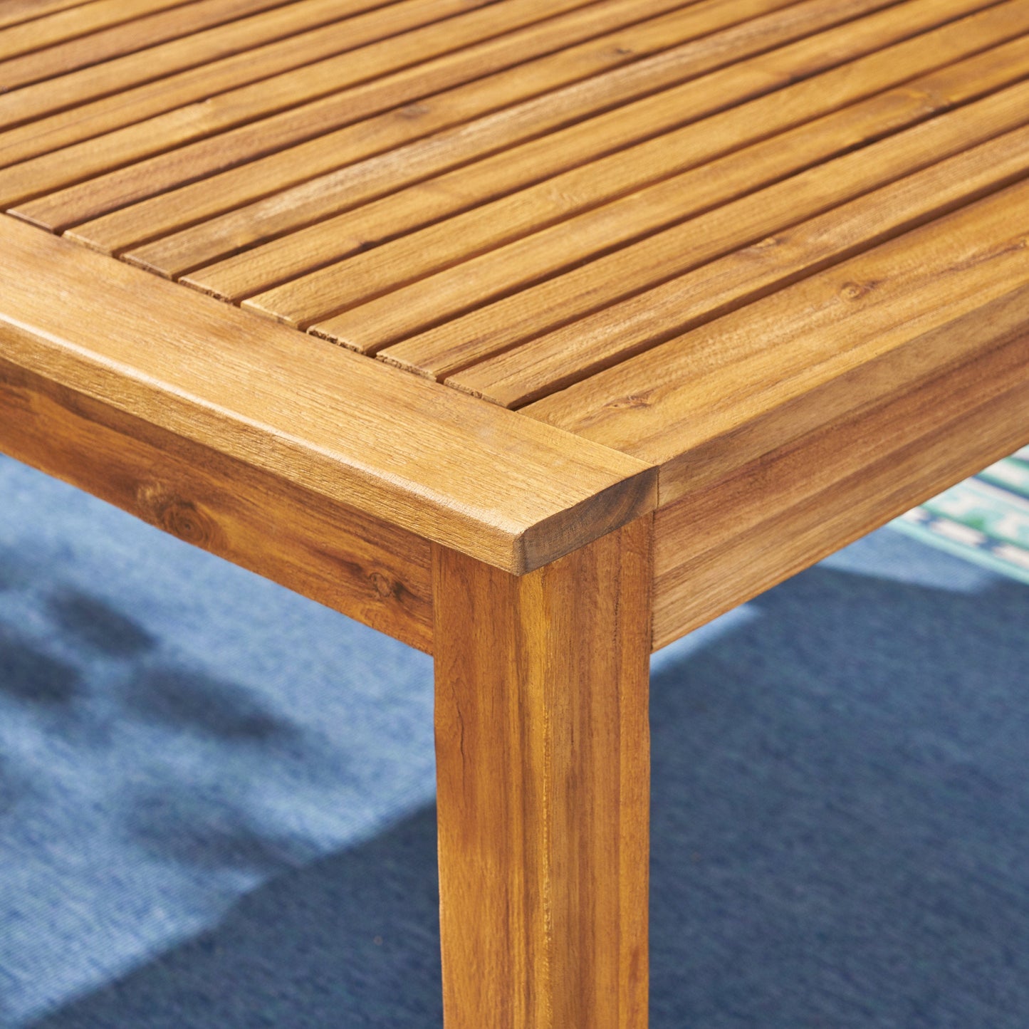 Outdoor rustic acacia dining table with slatted surface and brown finish by HouseOfZazla on Tampa Home & Garden Store