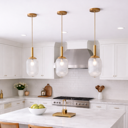 Modern Style Pendant Lamp - Bronze and Clear with three ribbed glass shades over marble island on Tampa Home & Garden Store